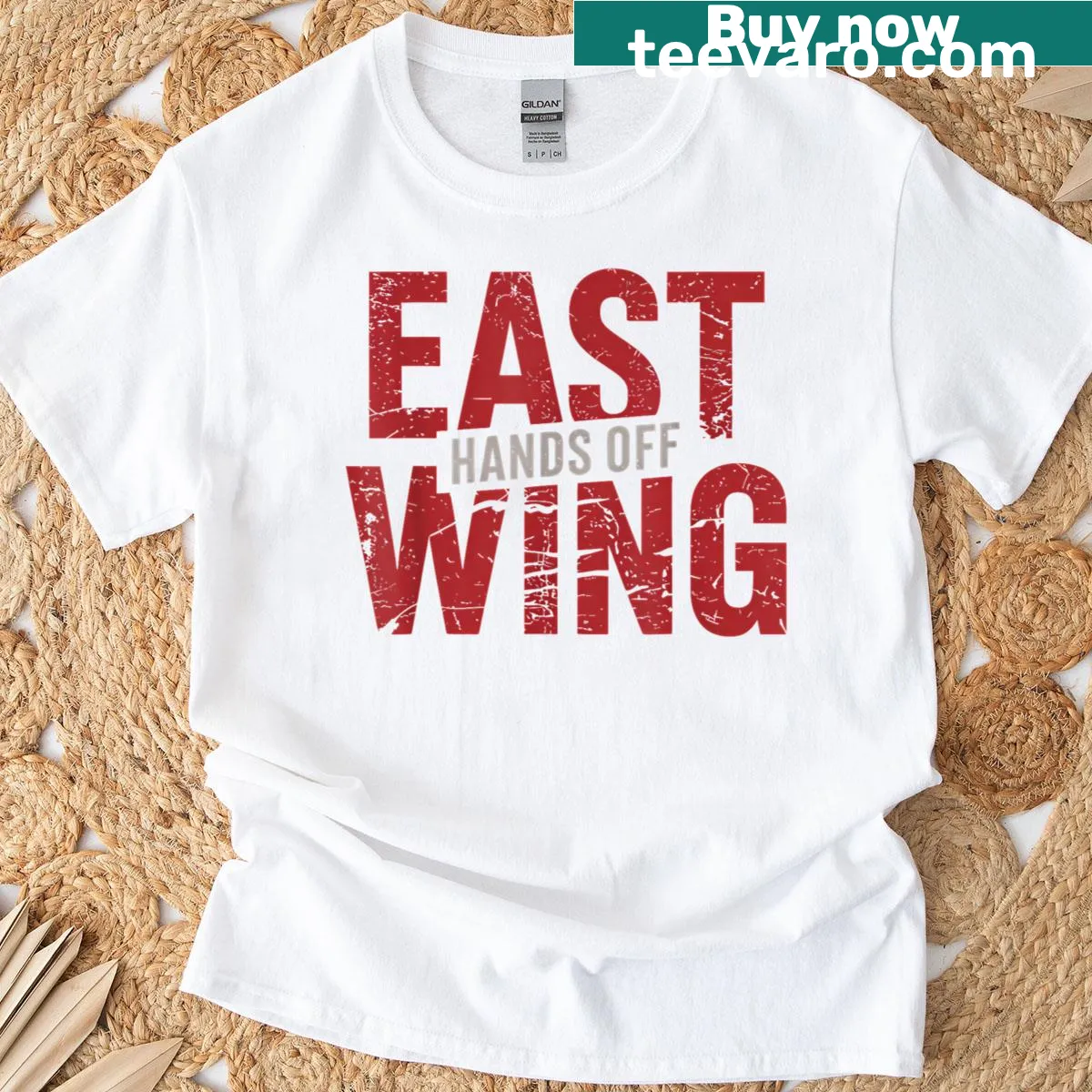 Bold text 'Hands Off East Wing' on a protest T-shirt — on a men's t-shirt