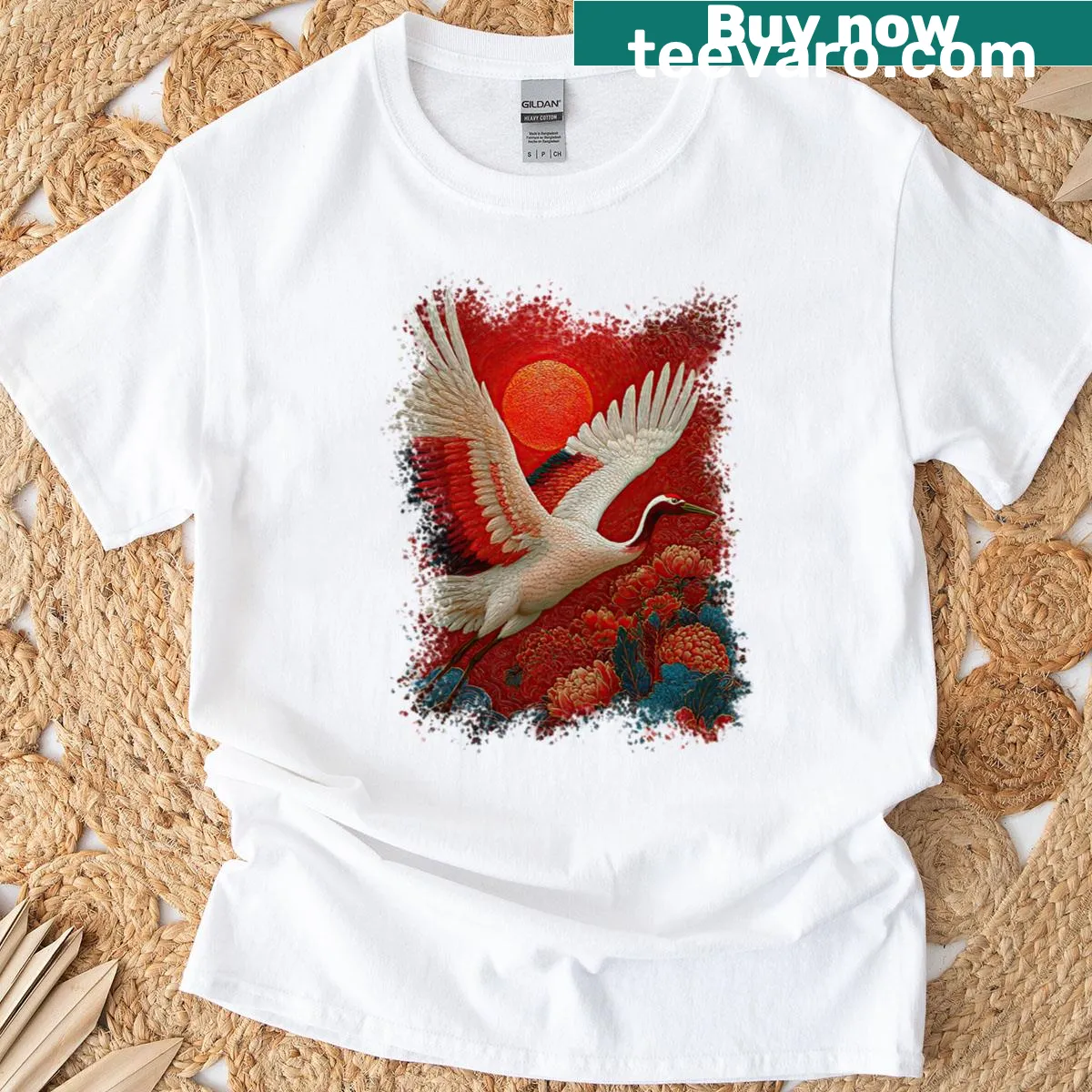 T-shirt featuring a red crane illustration beneath a sun. — on a men's t-shirt