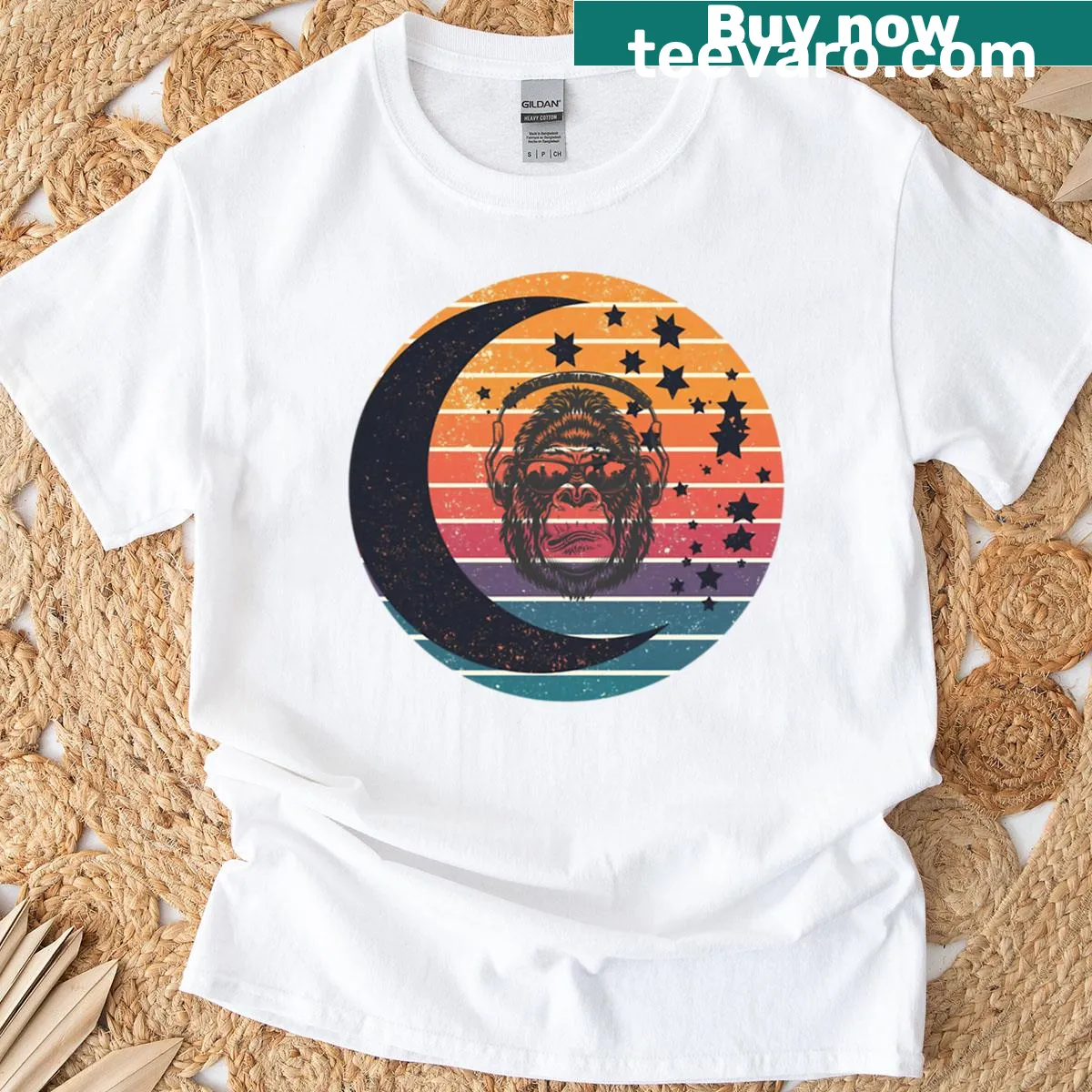 Vintage-style t-shirt with crescent moon and stars against a sunset — on a men's t-shirt