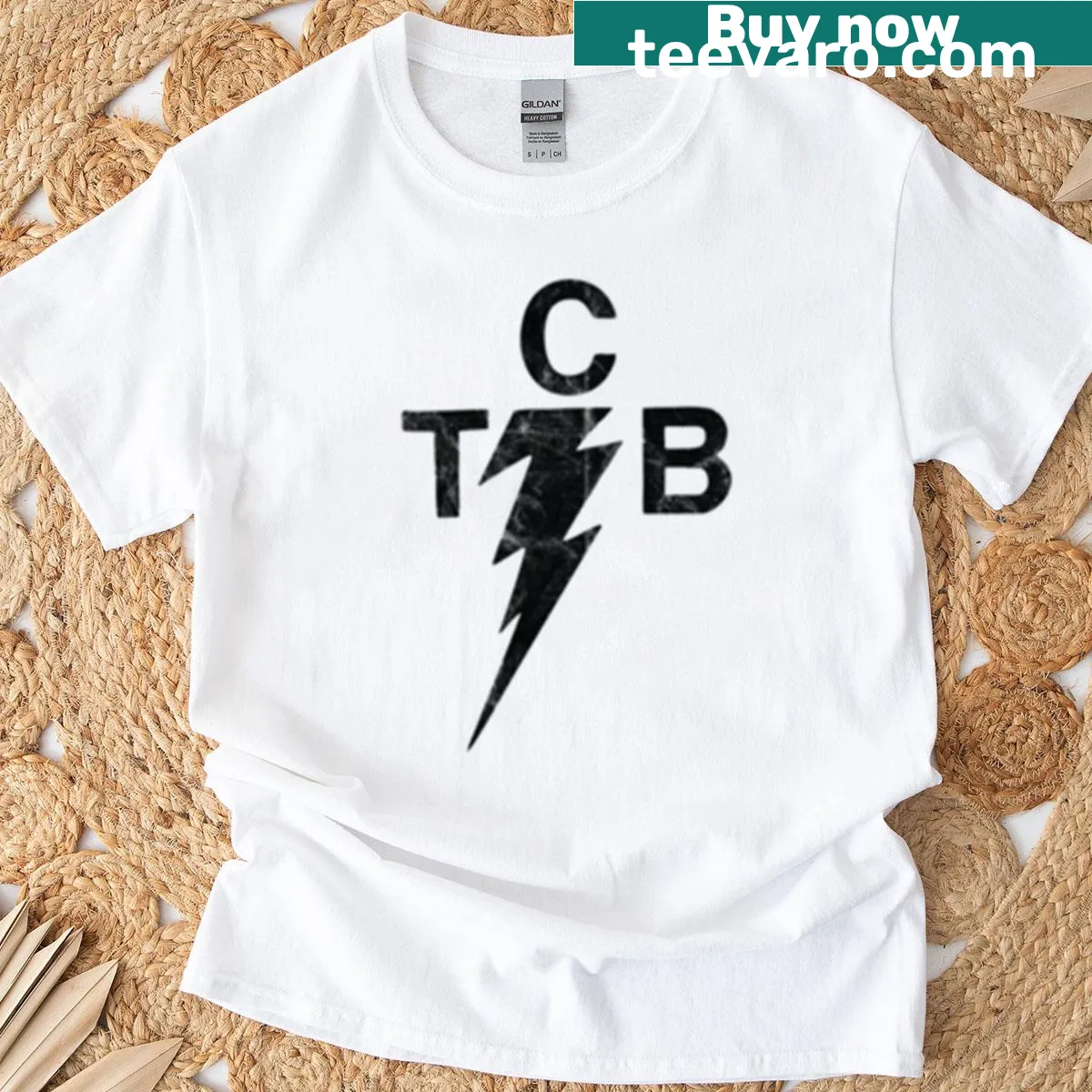 Retro t-shirt featuring a TCB logo and lightning bolt design — on a men's t-shirt