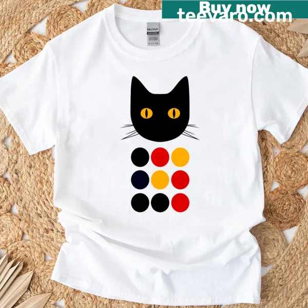 Cartoon cat surrounded by colorful dots on a t-shirt.