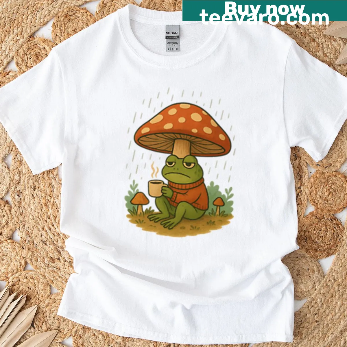 Illustrative t-shirt featuring a frog with coffee and mushrooms in the rain — on a men's t-shirt