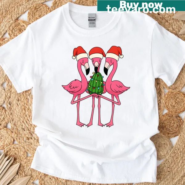 Tropical Christmas T-shirt featuring flamingos in Santa hats and lights