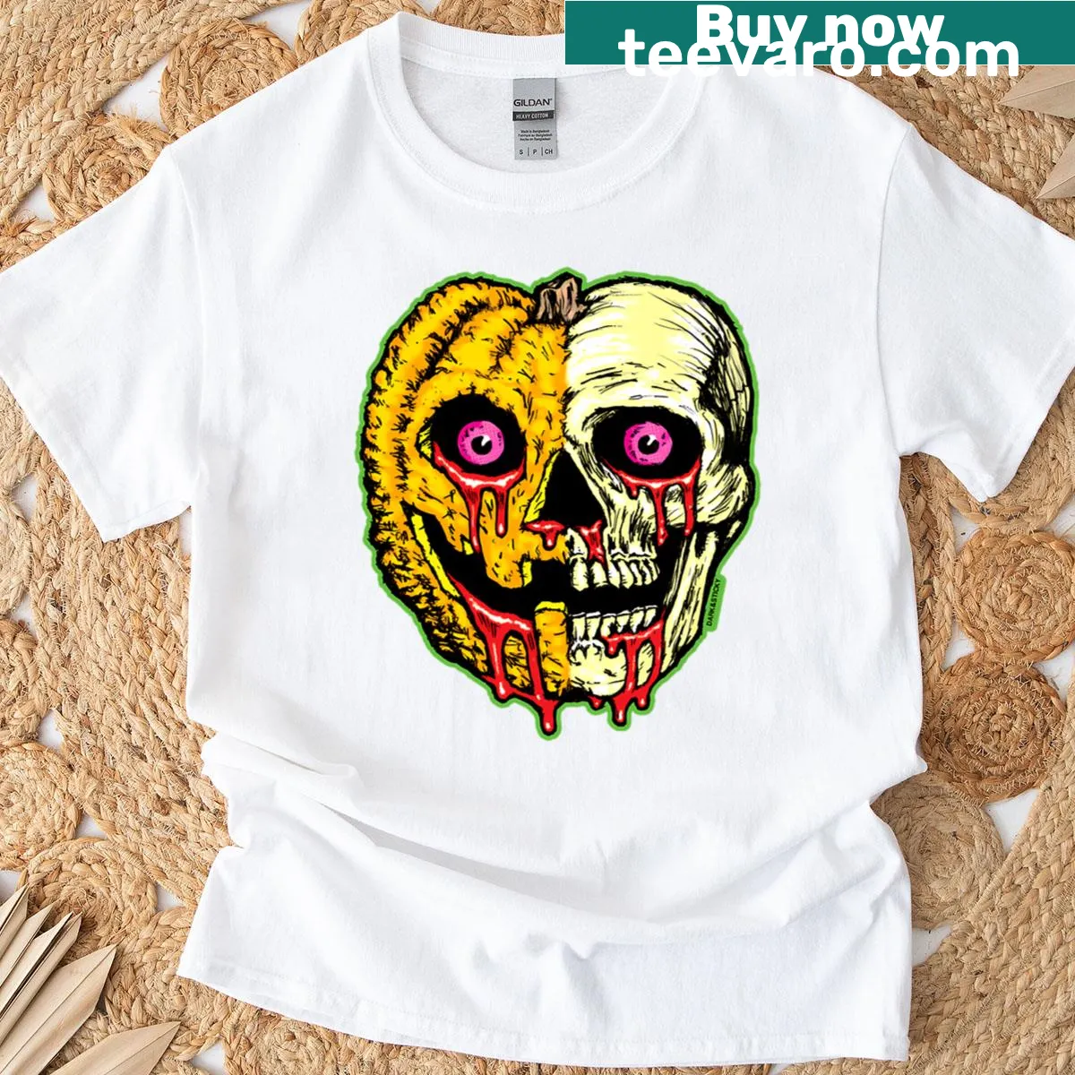 Halloween-themed T-shirt featuring a pumpkin and skull graphic. — on a men's t-shirt