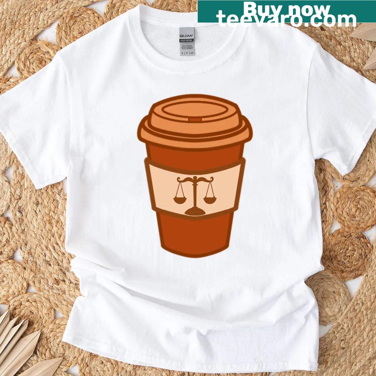 Minimalist T-shirt with coffee cup and scales of justice graphic — on a men's t-shirt