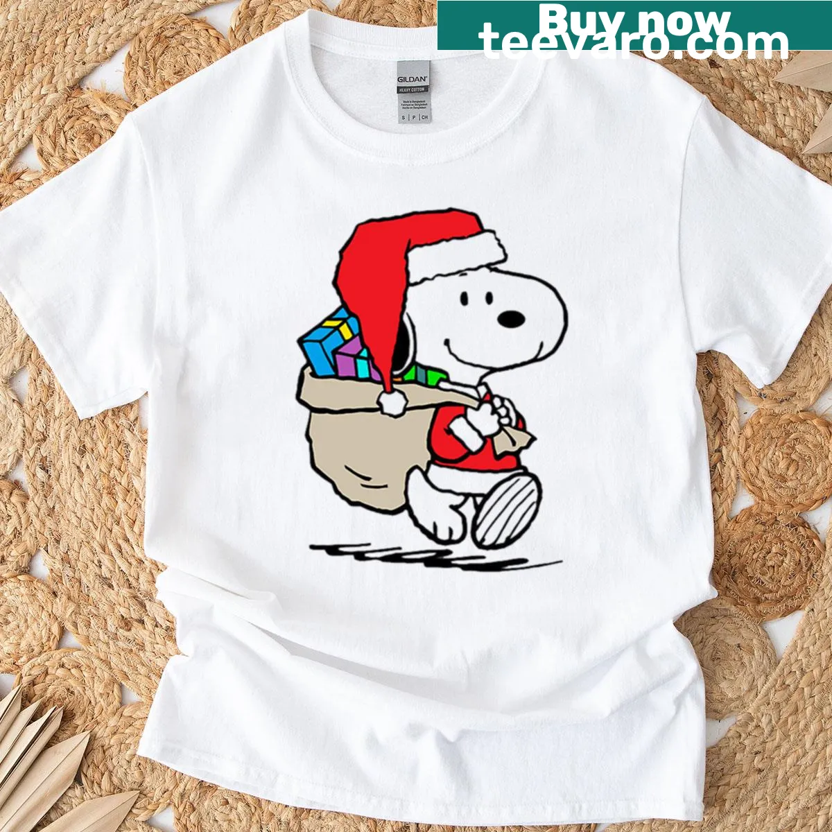 Snoopy in a Christmas setting graphic on T-shirt — on a men's t-shirt