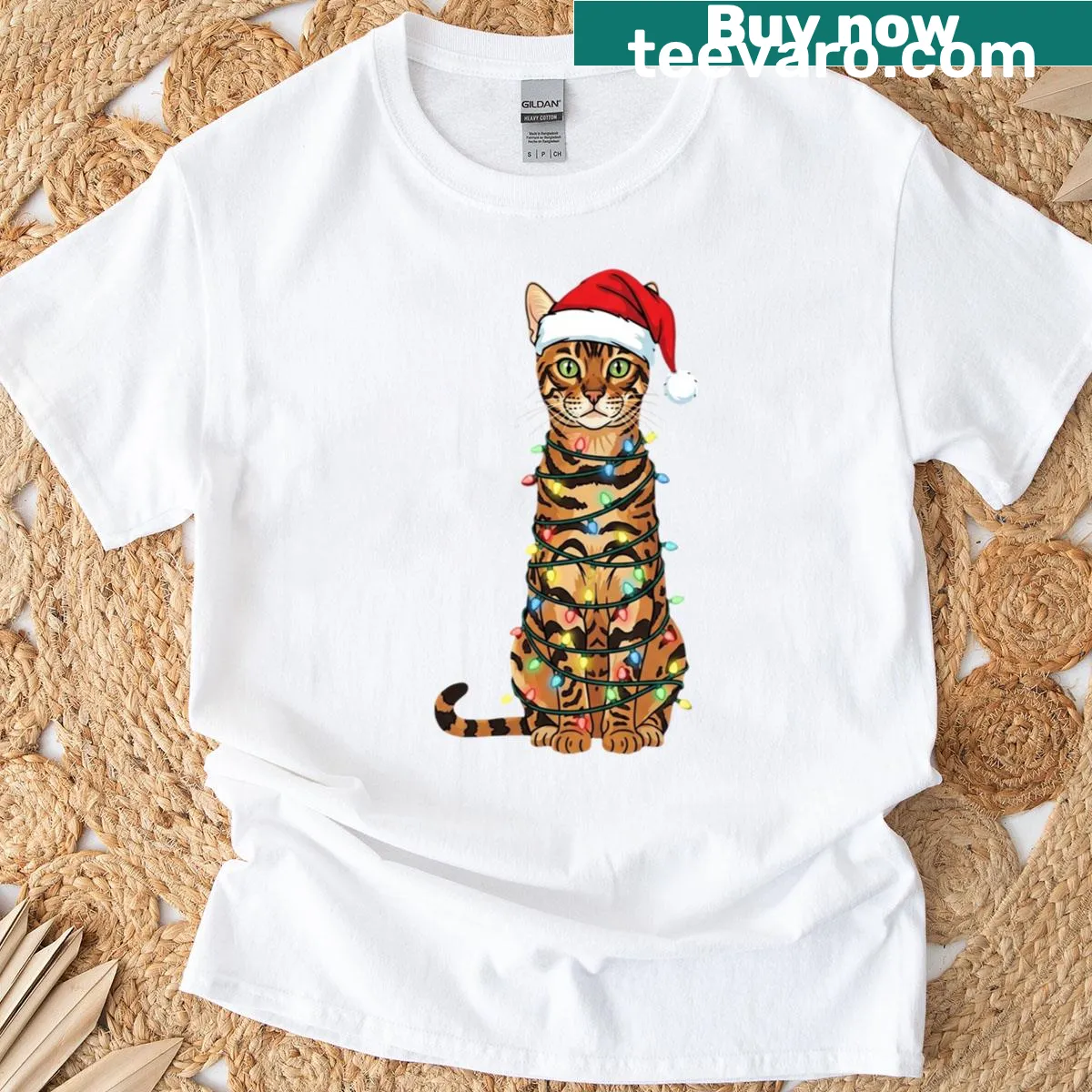 Bengal cat in Santa hat with Christmas tree graphic t-shirt — on a men's t-shirt