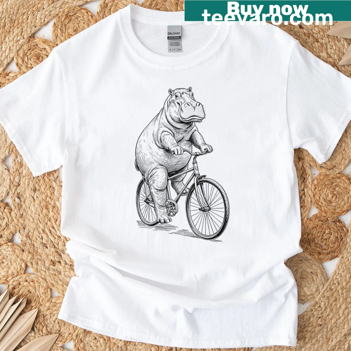 Vintage hippo riding a bicycle graphic on funny t-shirt — on a men's t-shirt