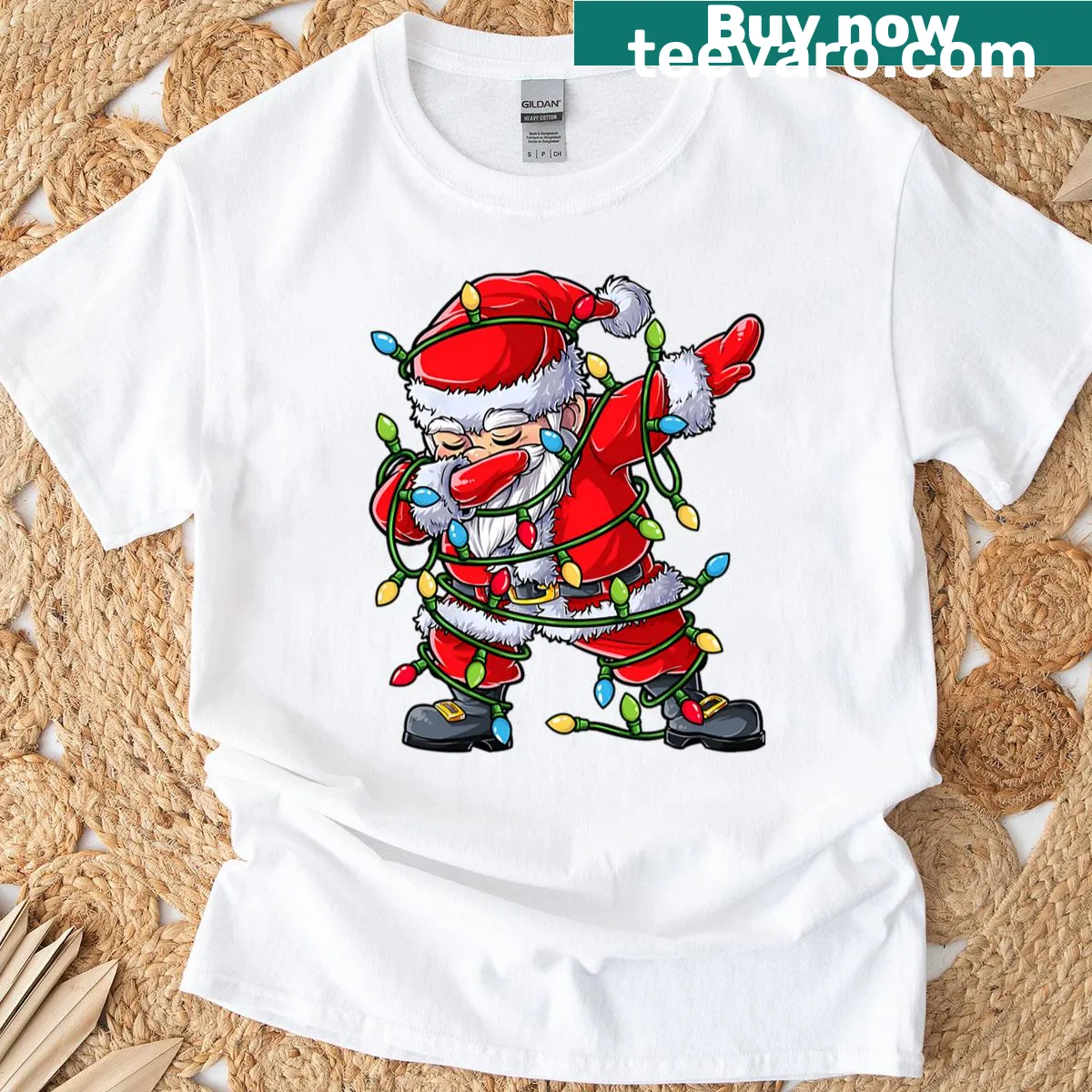 Cartoon Santa dabbing beside a Christmas tree graphic T-shirt — on a men's t-shirt