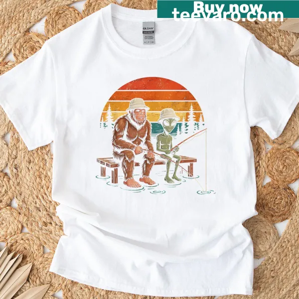 Illustrated funny t-shirt featuring an alien and Sasquatch fishing scene
