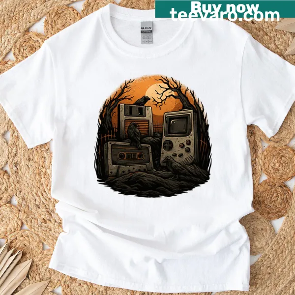 Retro Halloween shirt with graveyard, cassette, and Gameboy graphic.