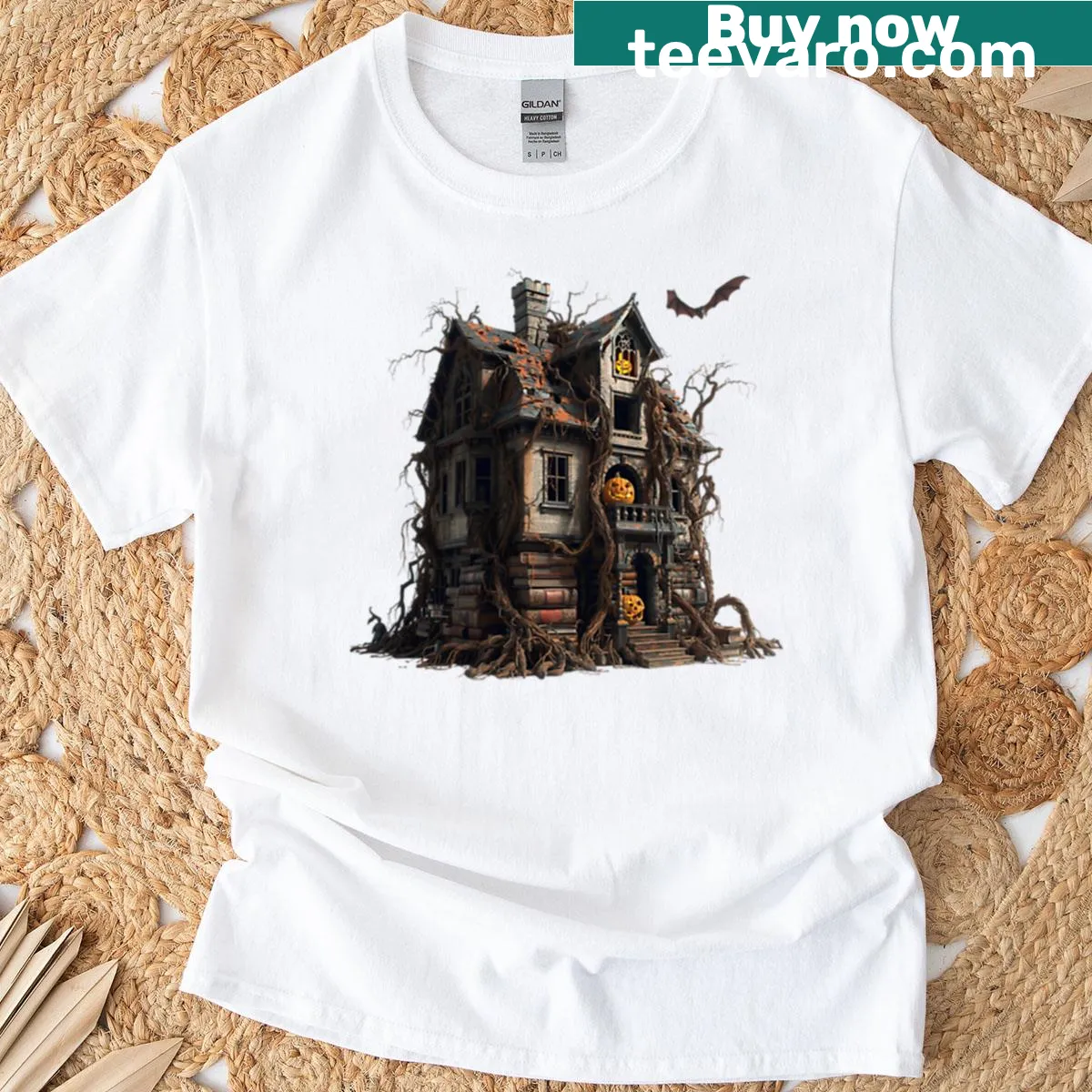 Haunted house t-shirt with bats, pumpkins, and a scary sky — on a men's t-shirt