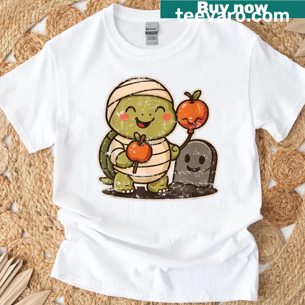 Cute cartoon turtle mummy holding candy apples on a T-shirt