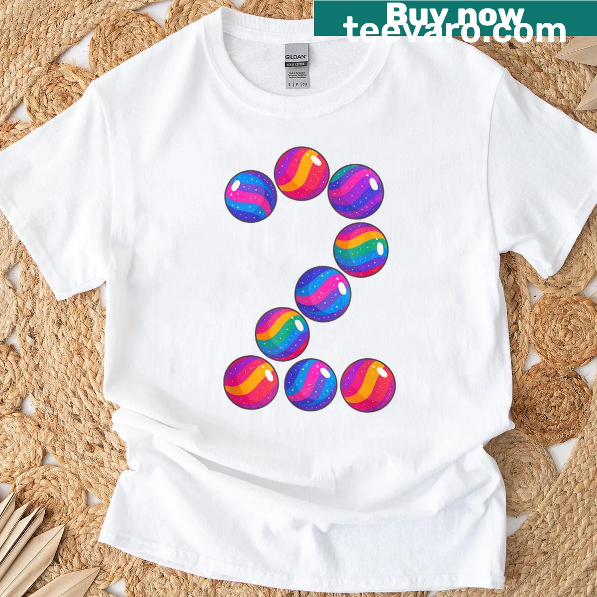 Kids T-shirt with a graphic of a rainbow bouncy ball and the number two. — on a men's t-shirt