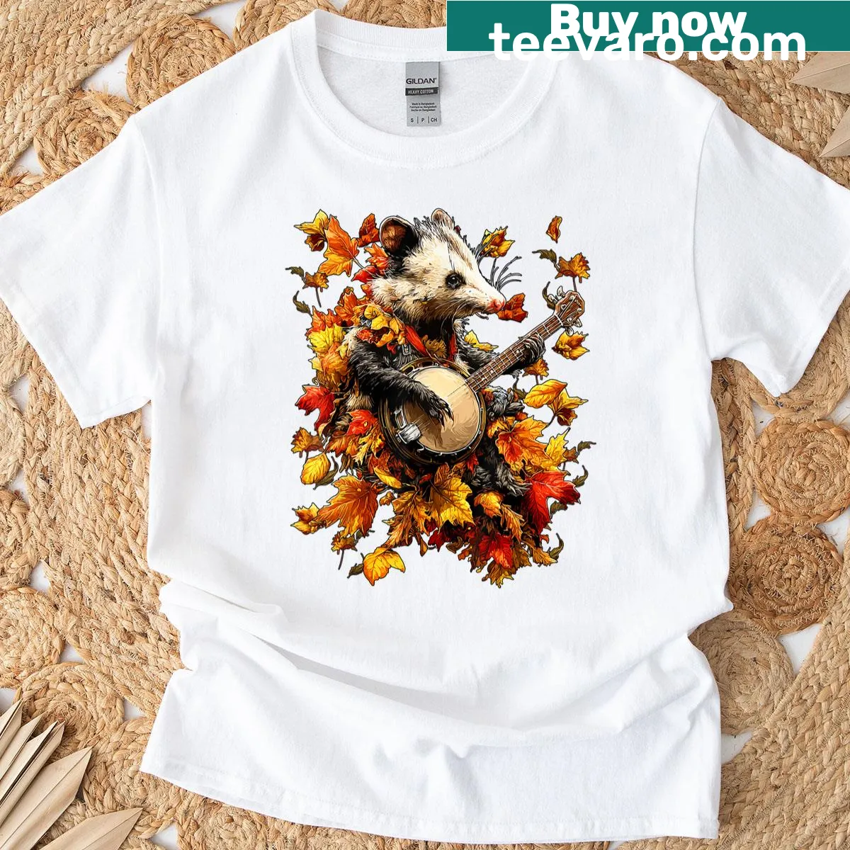 T-shirt featuring an opossum playing banjo amidst autumn leaves in a whimsical design — on a men's t-shirt