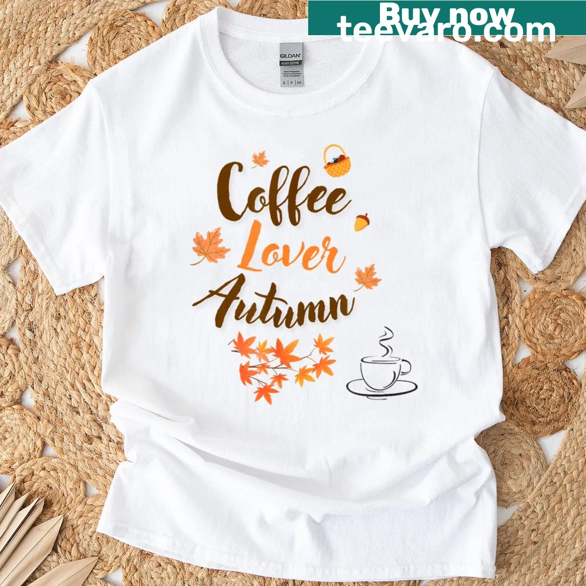 Autumn-themed t-shirt featuring coffee cups and fall leaves illustration — on a men's t-shirt