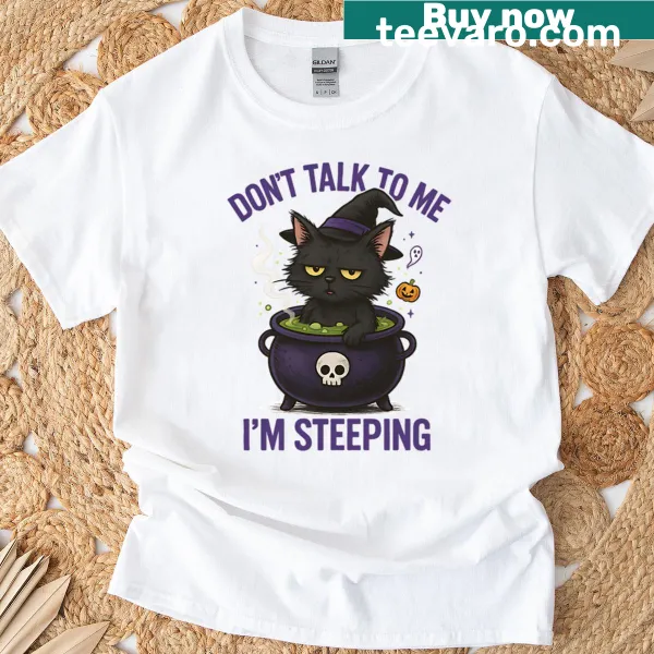 Funny Halloween T-shirt with a witch cat and humorous text.