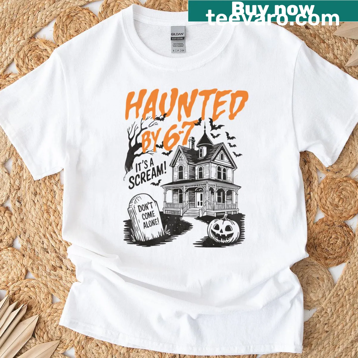 Spooky Halloween meme T-shirt with Haunted By 67 text — on a men's t-shirt