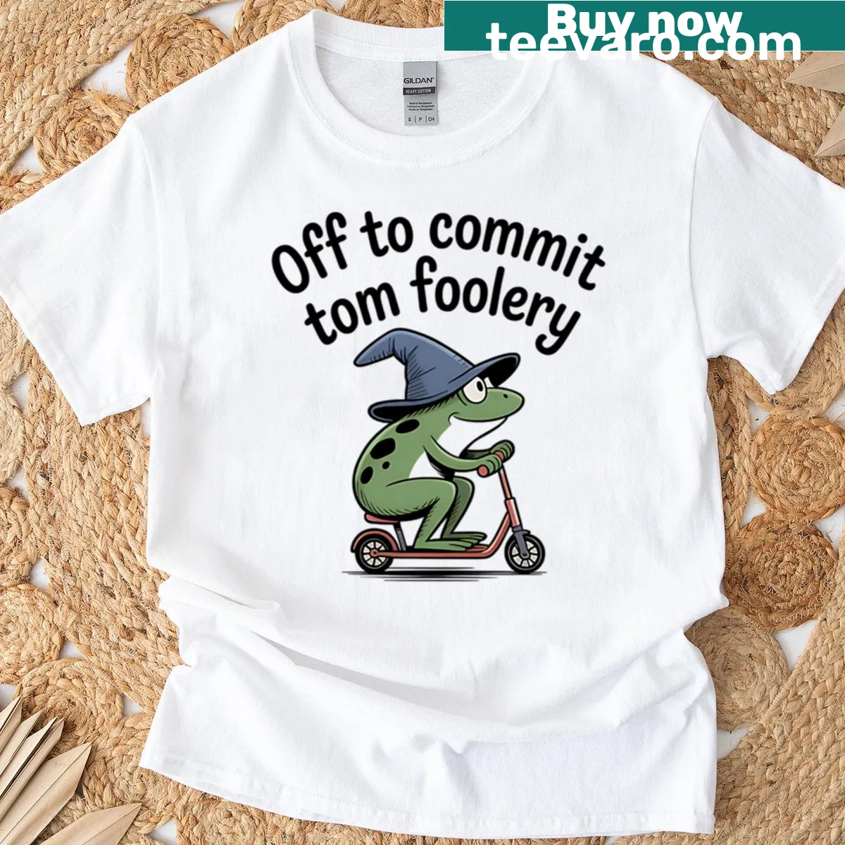 Whimsical frog on scooter T-shirt — on a men's t-shirt