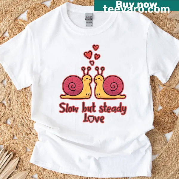 Illustrated t-shirt with a funny snail and the phrase 'Slow But Steady Love'