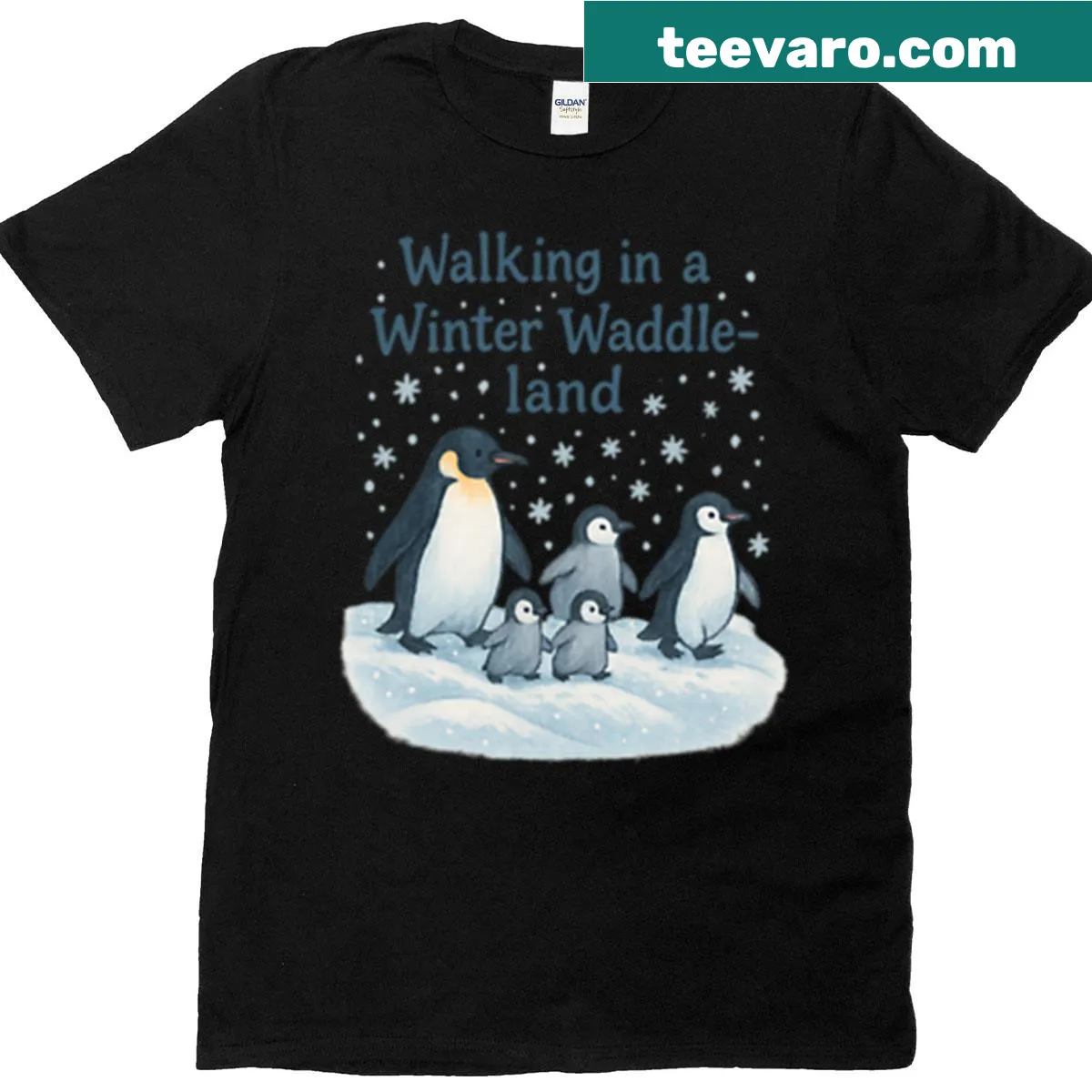 Cartoon penguins waddling in a winter landscape on a playful t-shirt — on a men's t-shirt
