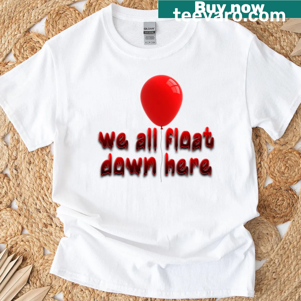 Horror-themed t-shirt featuring the phrase We All Float Down Here — on a men's t-shirt