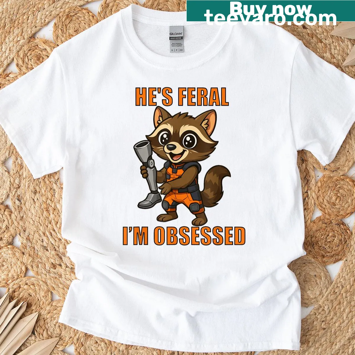 Cartoon raccoon t-shirt with text He's Feral I'm Obsessed — on a men's t-shirt