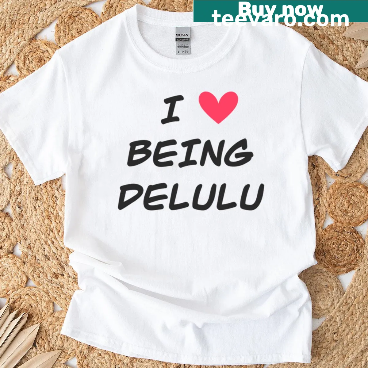 Playful t-shirt featuring bold text saying 'I Love Being Delulu' — on a men's t-shirt