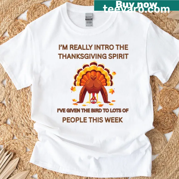 Funny Thanksgiving T-shirt featuring a humorous phrase about giving the bird