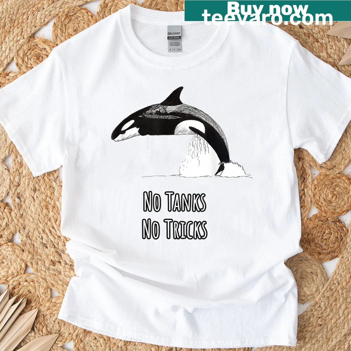 Bold illustration of an orca on a conservation-themed t-shirt — on a men's t-shirt