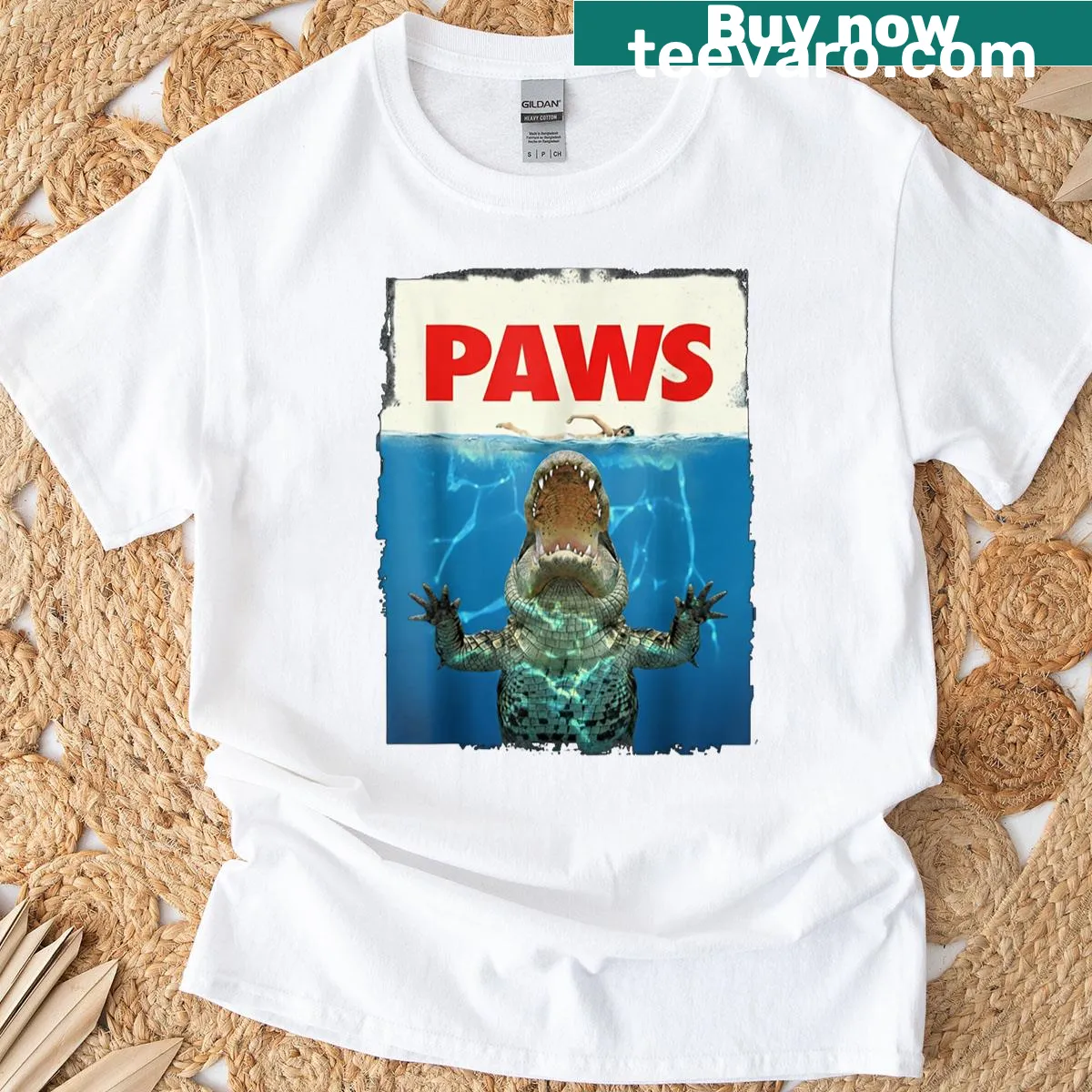 Cartoon crocodile surrounded by paws graphic on T-shirt — on a men's t-shirt