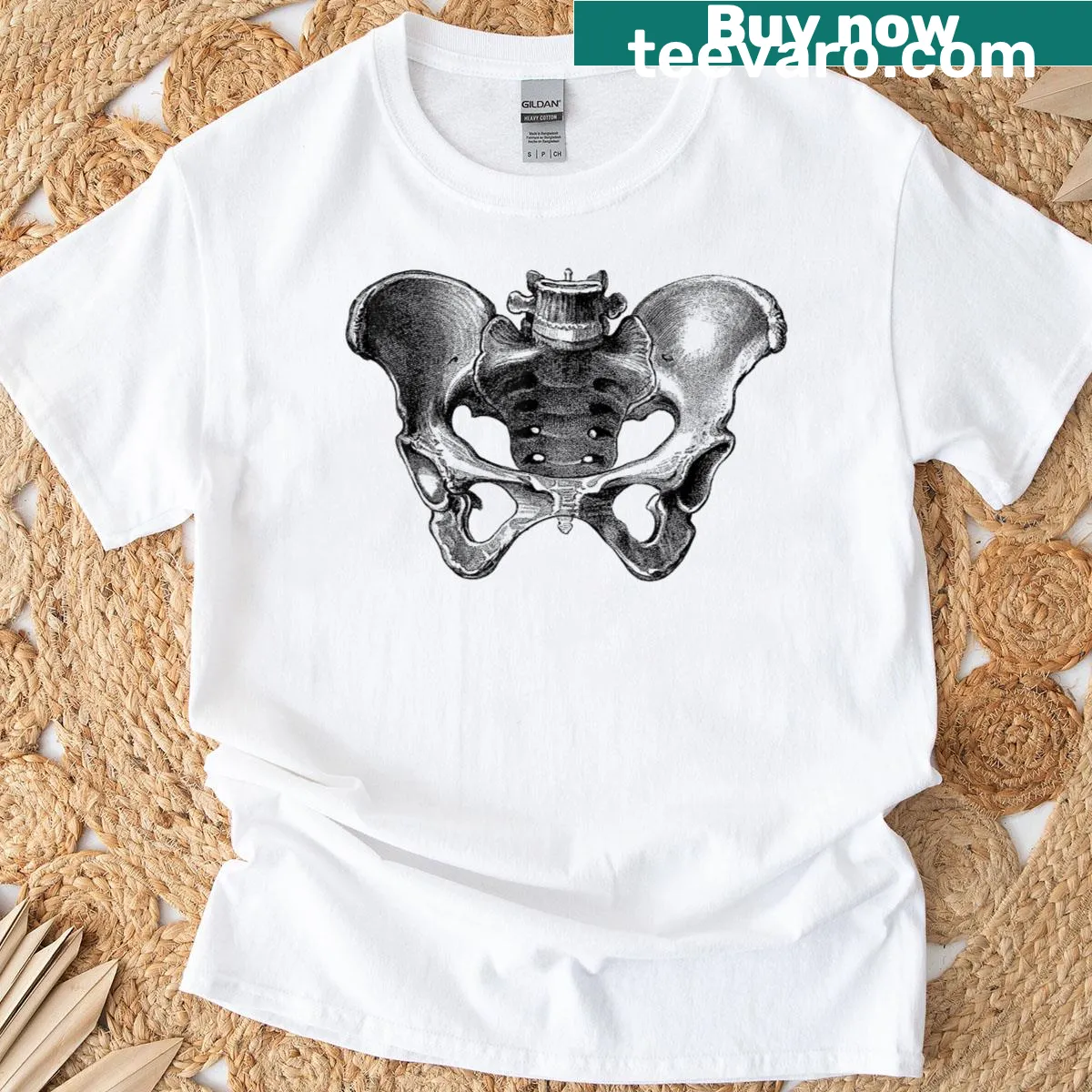 Vintage anatomical graphic t-shirt featuring pelvic bone design — on a men's t-shirt