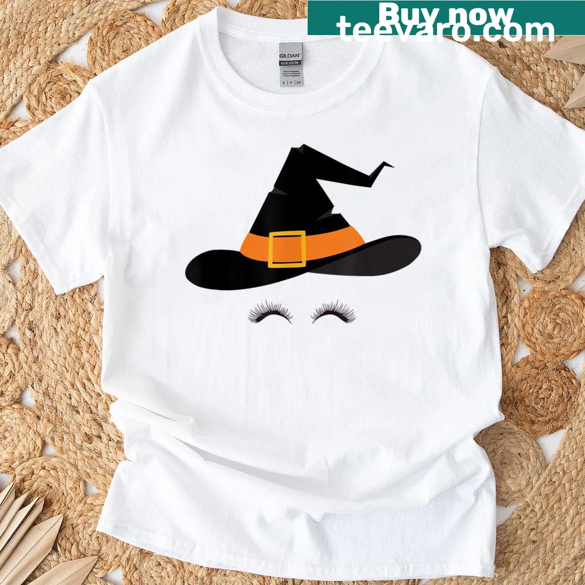 Cute Halloween t-shirt featuring a witch hat and eyelashes — on a men's t-shirt