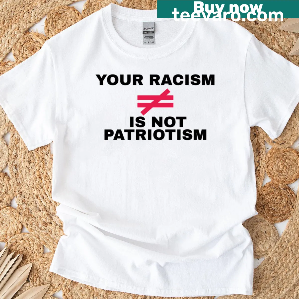 Oversized t-shirt with bold text: Your Racism Is Not Patriotism — on a men's t-shirt