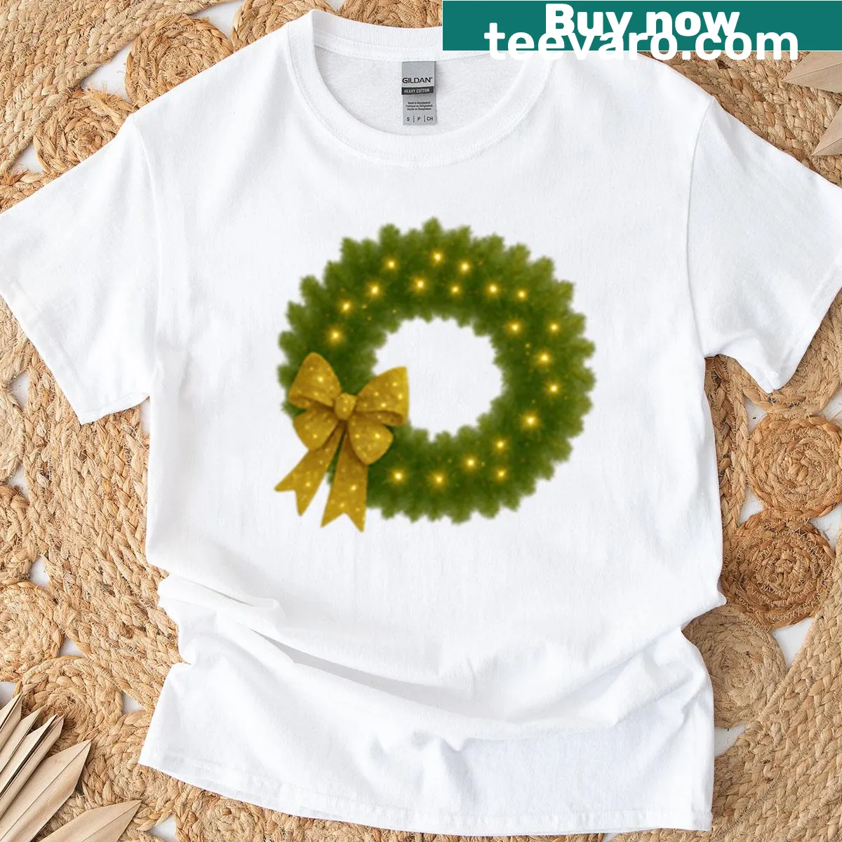 Christmas wreath T-shirt with gold bow design — on a men's t-shirt