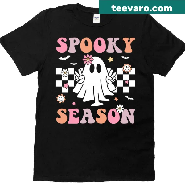 Retro Halloween T-shirt with a cheerful ghost graphic and text.