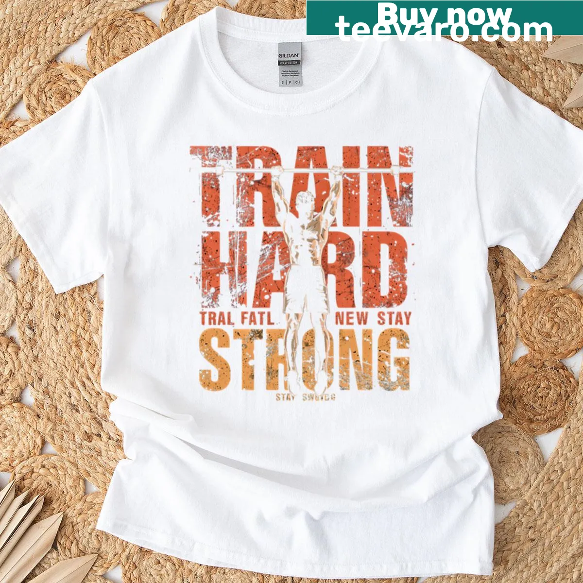 Inspirational 'Train Hard Stay Strong' typography on a gym t-shirt — on a men's t-shirt