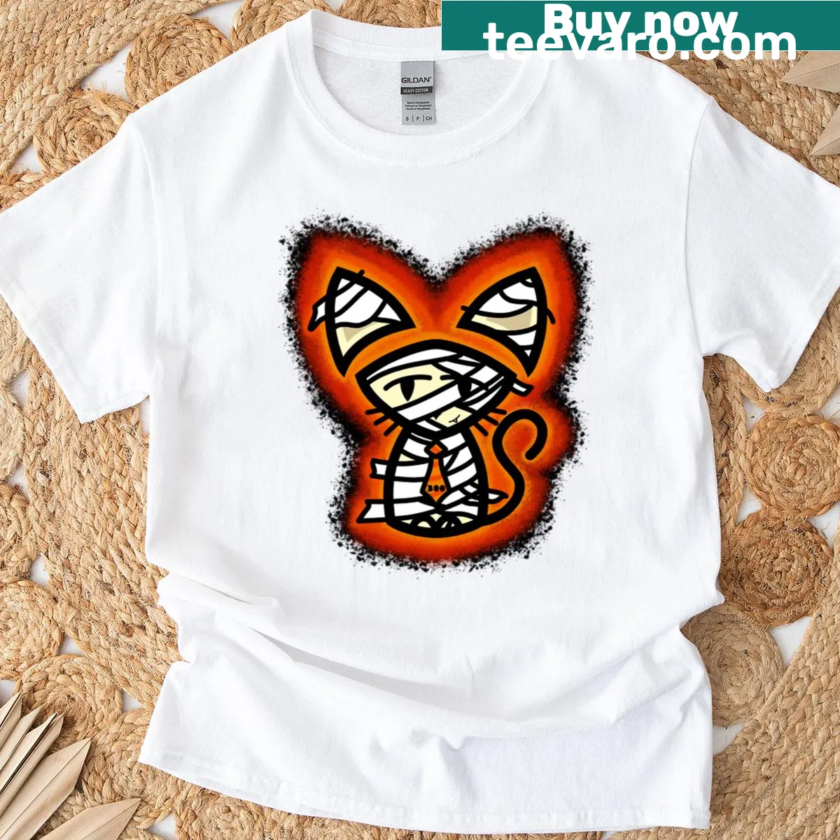 Humorous cat in a mummy costume graphic t-shirt with glow effects — on a men's t-shirt
