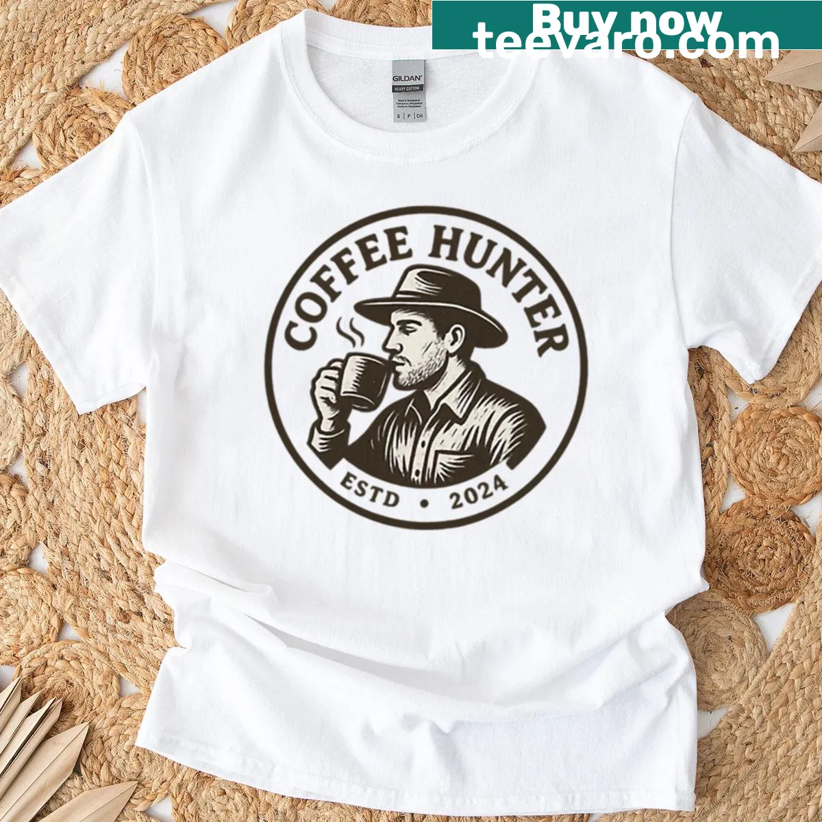 Playful Coffee Hinter logo T-shirt with badge design — on a men's t-shirt