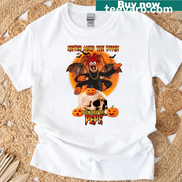 Halloween graphic T-shirt with quirky design warning about witches and Pepe