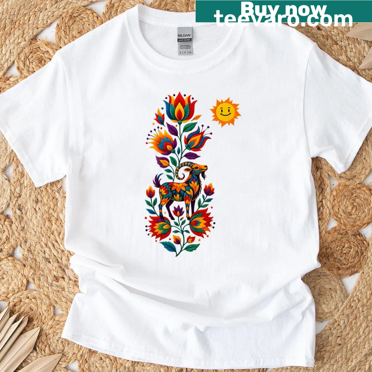 T-shirt featuring an embroidered goat design surrounded by flowers — on a men's t-shirt