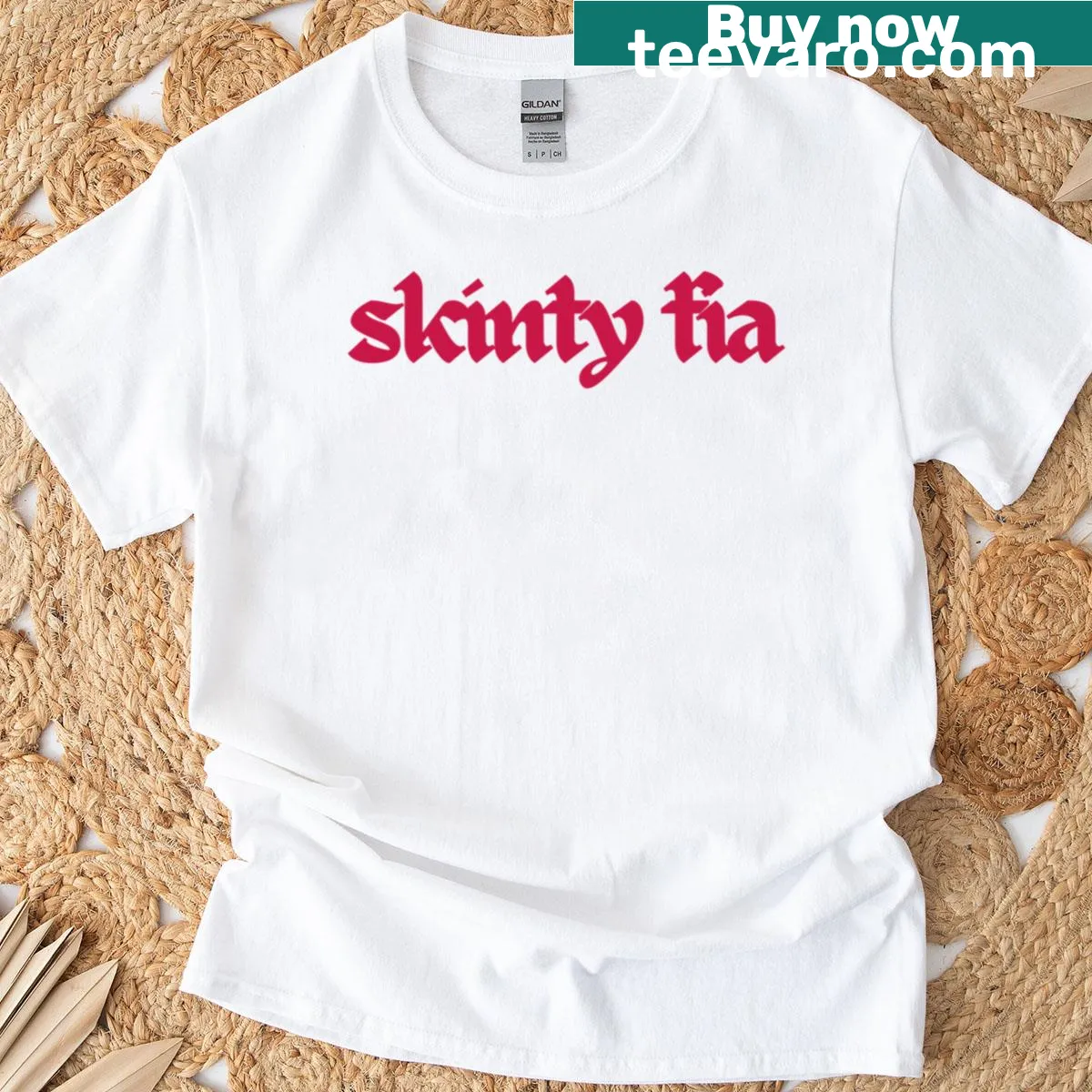 T-shirt featuring Skinty Fia band logo design — on a men's t-shirt