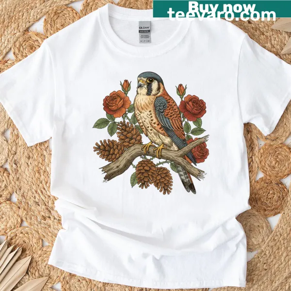 Artistic t-shirt featuring an American Kestrel and botanical elements.