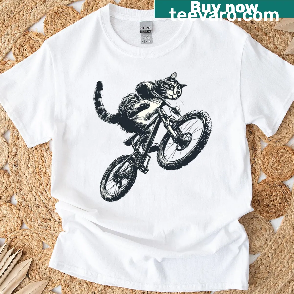 Whimsical t-shirt featuring a black cat riding a bicycle — on a men's t-shirt