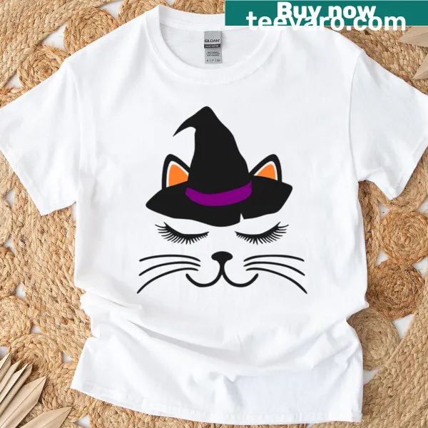 Illustration of a resting cat face with Halloween-themed elements on a t-shirt