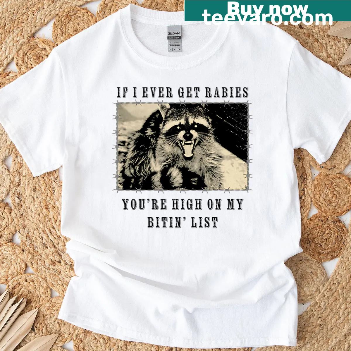 Oversized t-shirt with raccoon graphic and humorous biting list text — on a men's t-shirt