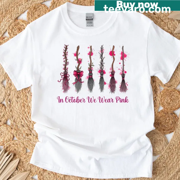 Illustration of witches' brooms with a pink ribbon