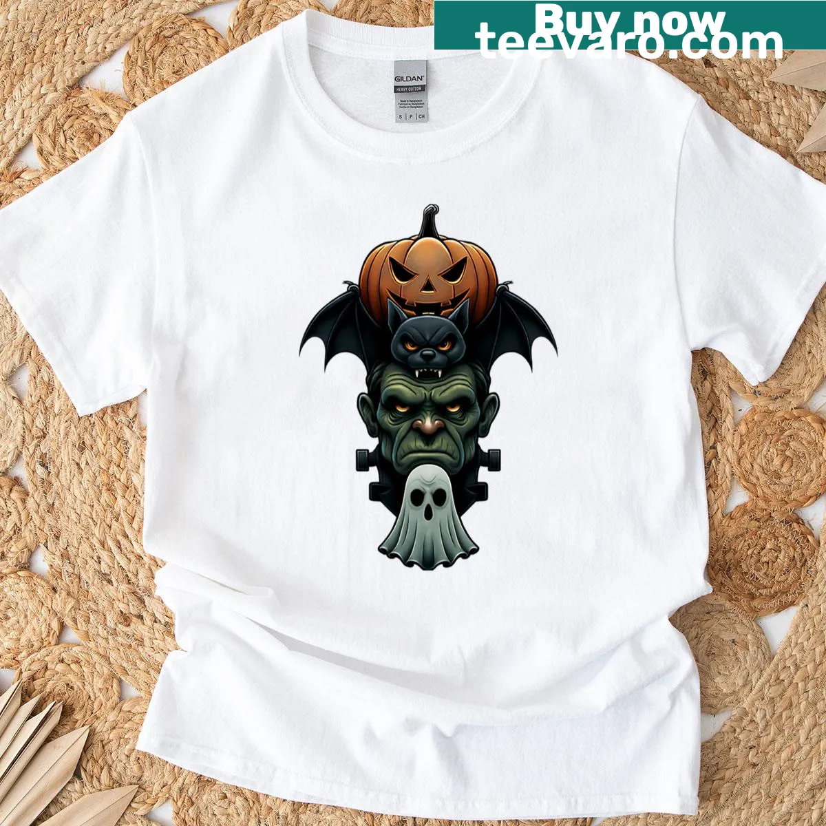 Oversized t-shirt featuring stacked Halloween monsters: Frankenstein, pumpkin, bat, ghost — on a men's t-shirt