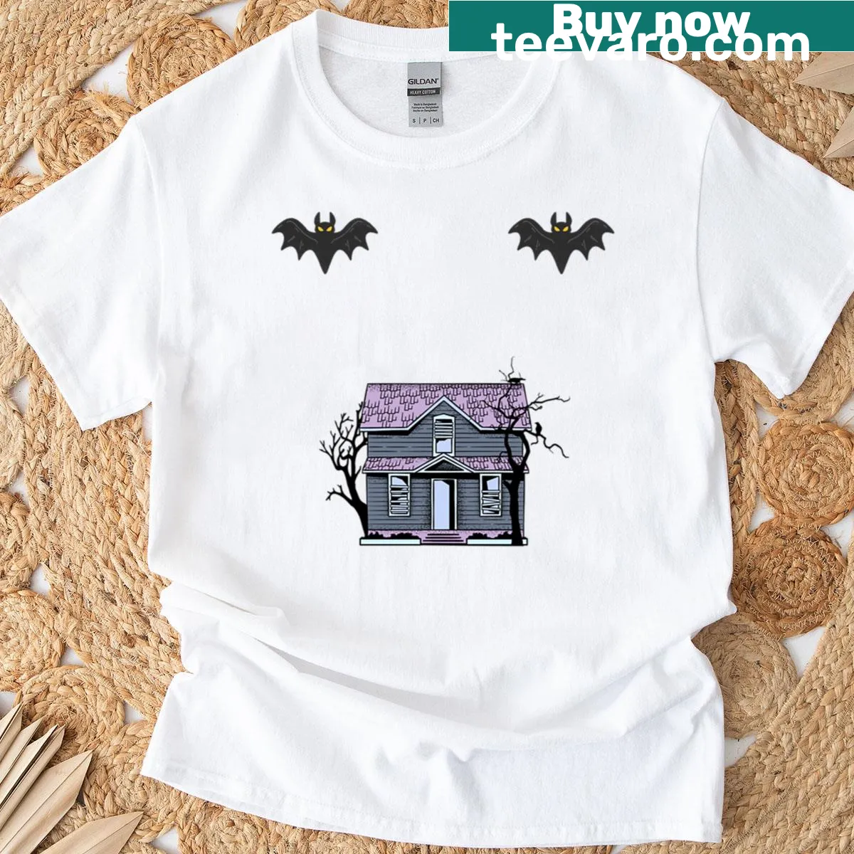 Oversized t-shirt with a spooky house and flying bats design — on a men's t-shirt