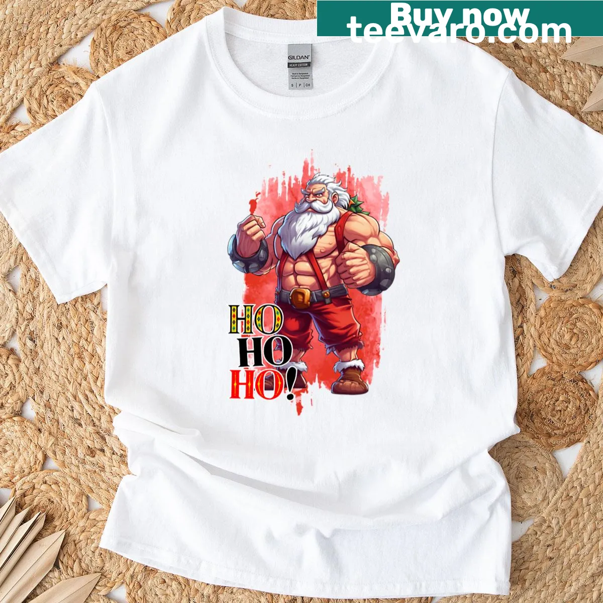 Cartoon Santa flexing muscles saying 'Ho Ho Ho' on T-shirt — on a men's t-shirt